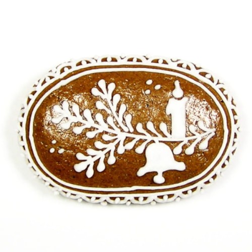 Zdjęcie udekorowanego piernika wyciętego foremką w kształcie owalu