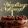 Złoty topper umieszczony w torcie urodzinowym