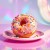 Donut oblany rozowym lukrem i posypka