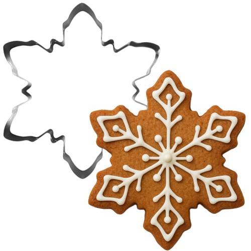 Foremka śnieżynka i ozdobiony lukrem pierniczek