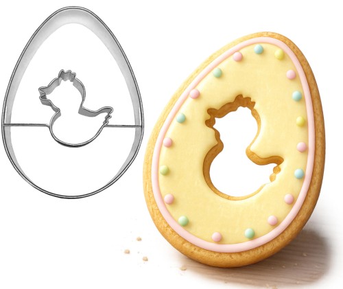 Foremka jajko z otworkiem w kształcie kurczątka oraz ciasteczko ozdobione lukrem