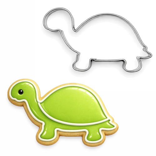 Metalowy wykrawacz w kształcie żółwia oraz ciasteczko udekorowane zielonym lukrem