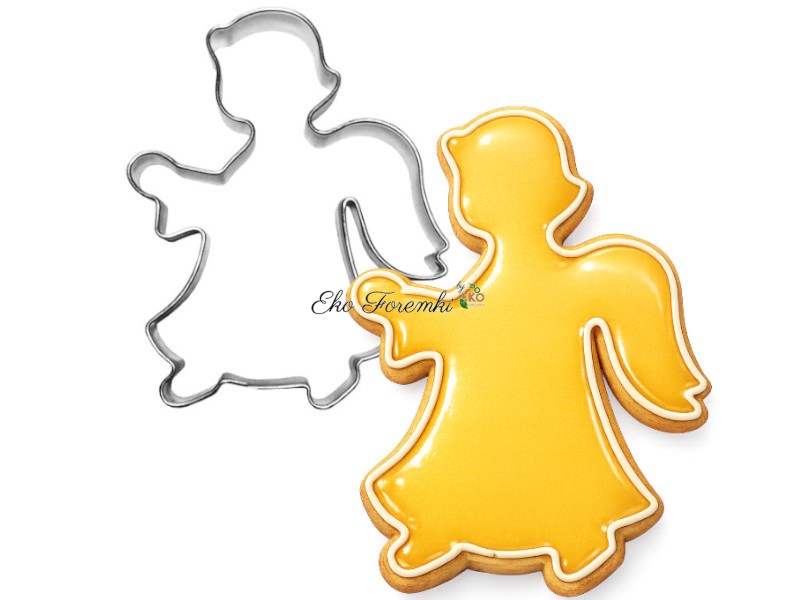 foremka anioł i ciasteczko ozdobione żółtym lukrem