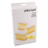 Opakowanie włoskiej formy Silikomart Mini Cake z silikonową formą w kształcie prostokątów oraz przykładowymi mini ciastkami na froncie.